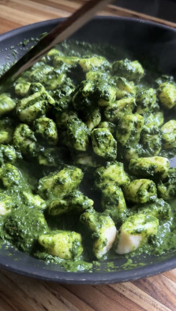 homemade cottage cheese gnocchi tossed in a vibrant kale sauce