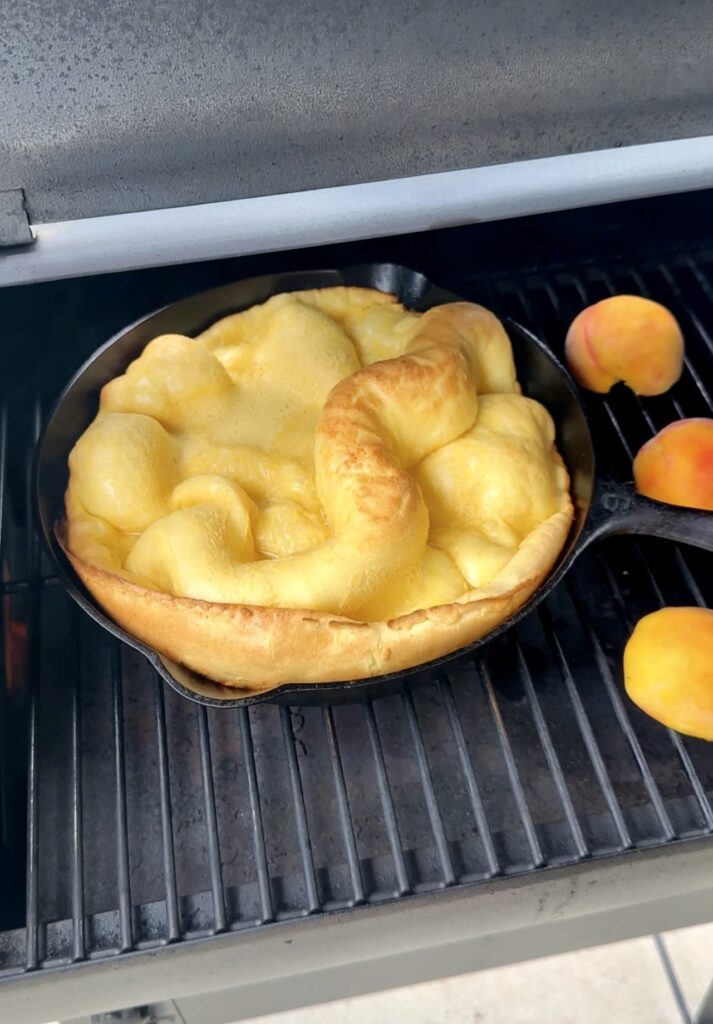 grilled dutch baby aside halved peaches