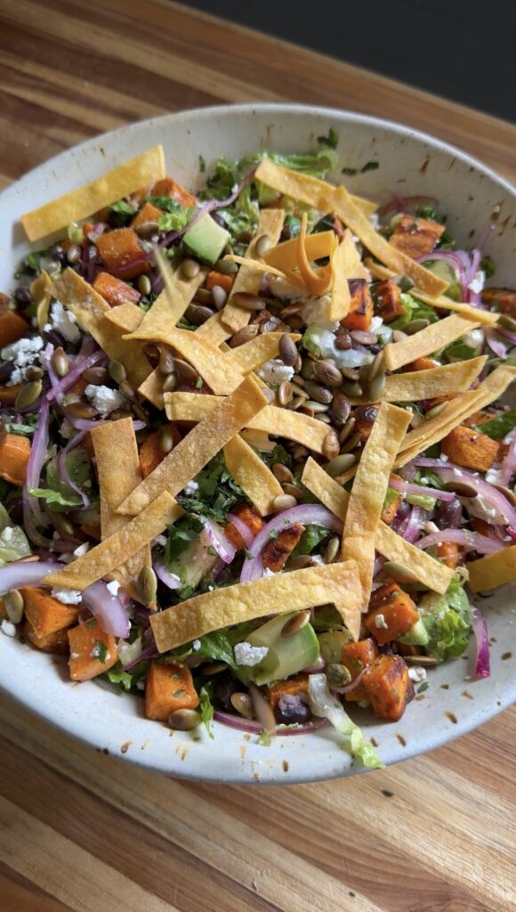 winter taco salad in bowl on cutting board