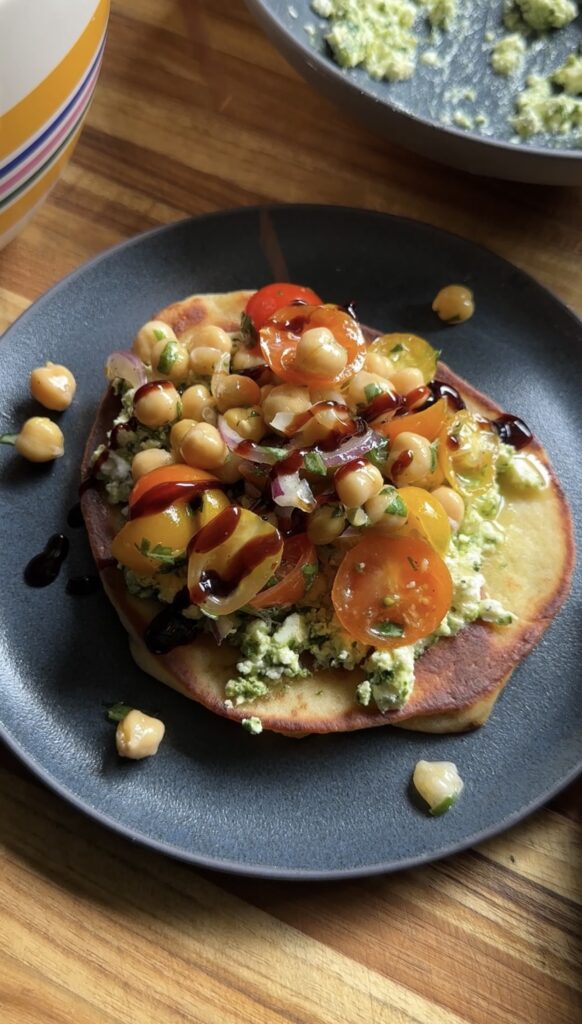 smashed feta caprese flatbread on a plate