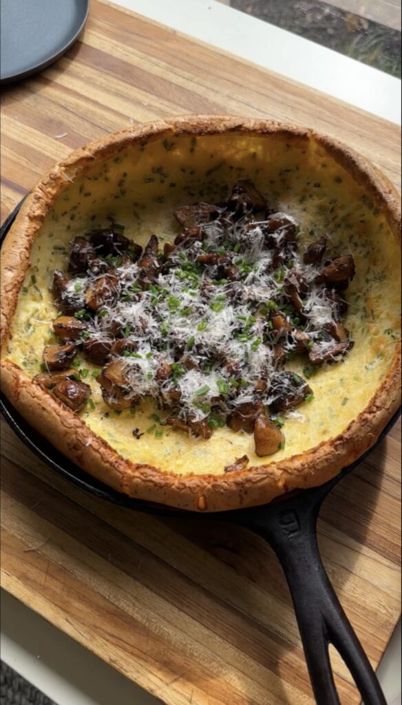 savory cottage cheese dutch baby on cutting board