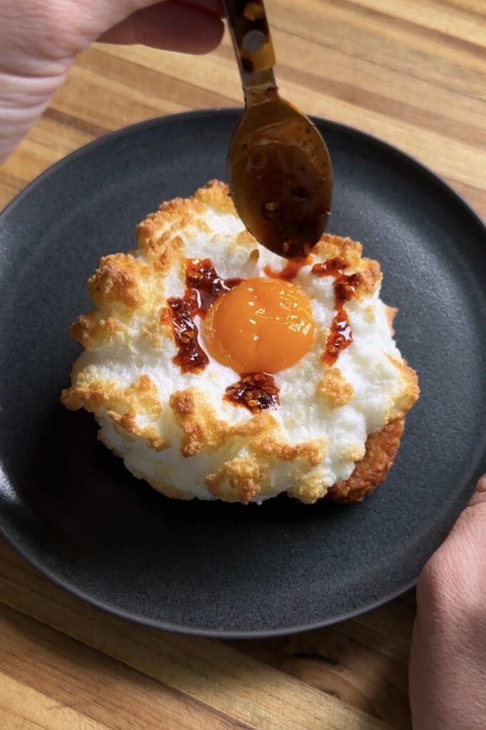 drizzling chili crisp onto cottage cheese cloud eggs