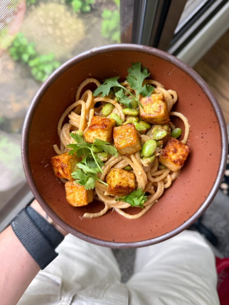 peanut noodle bowl with tofu and edamame