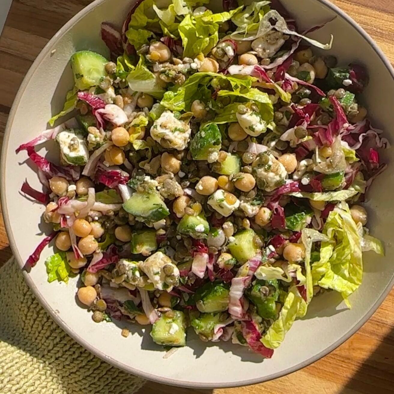 a close-up of a mediterranean lentil and chickpea salad