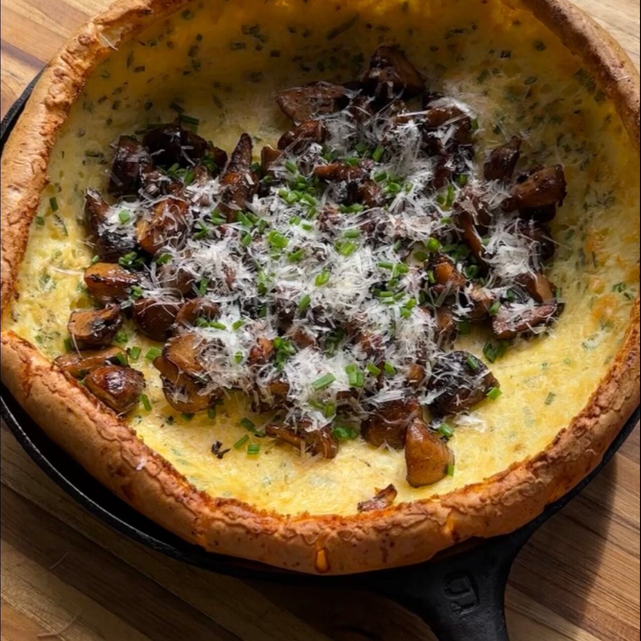 savory cottage cheese dutch baby on cutting board