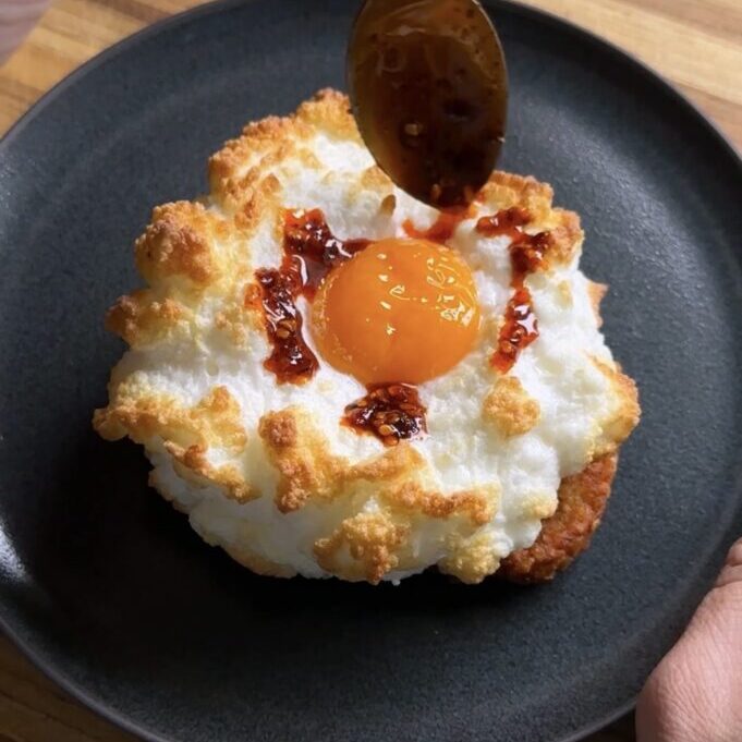 drizzling chili crisp onto cottage cheese cloud eggs