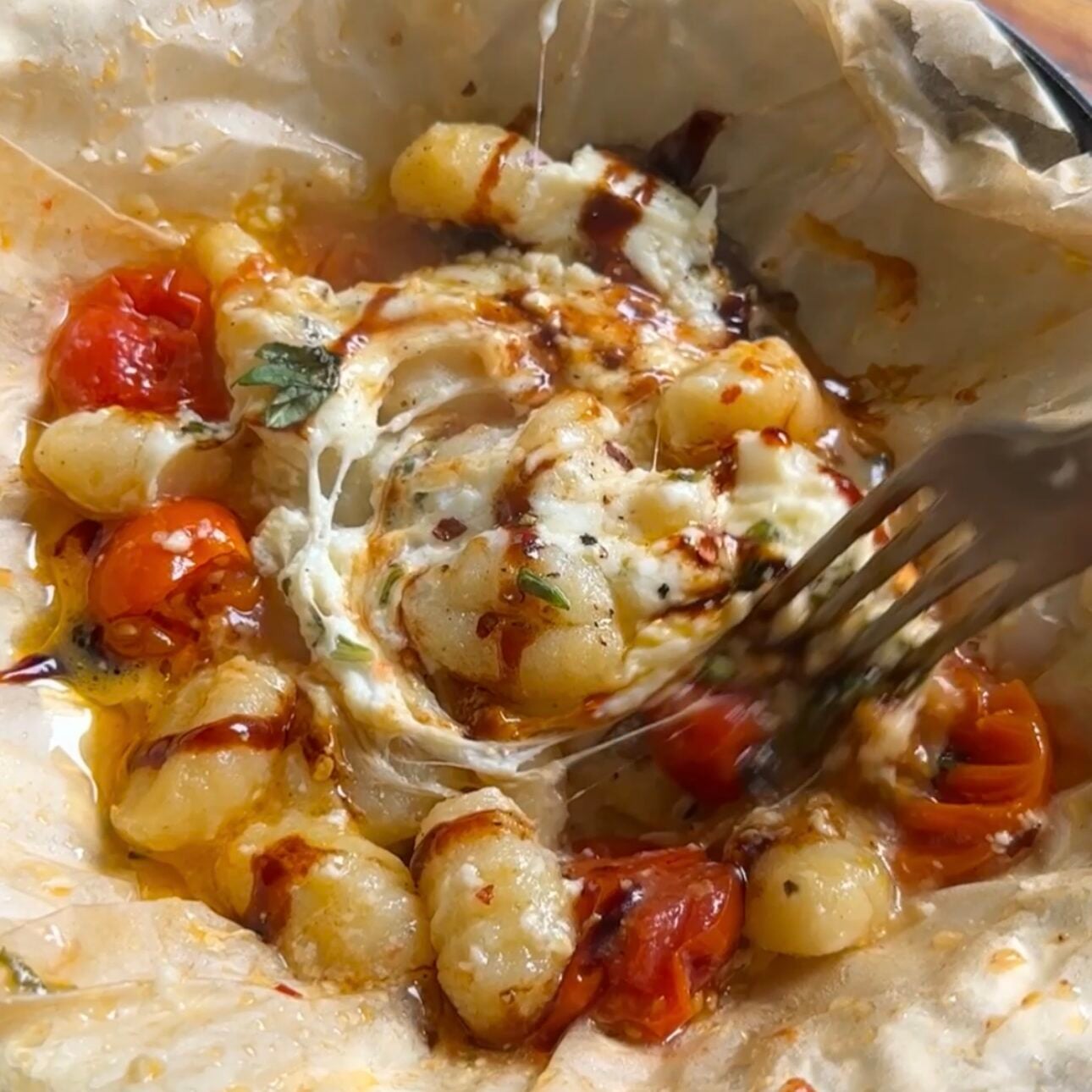 a fork digging into cottage cheese gnocchi foil packets