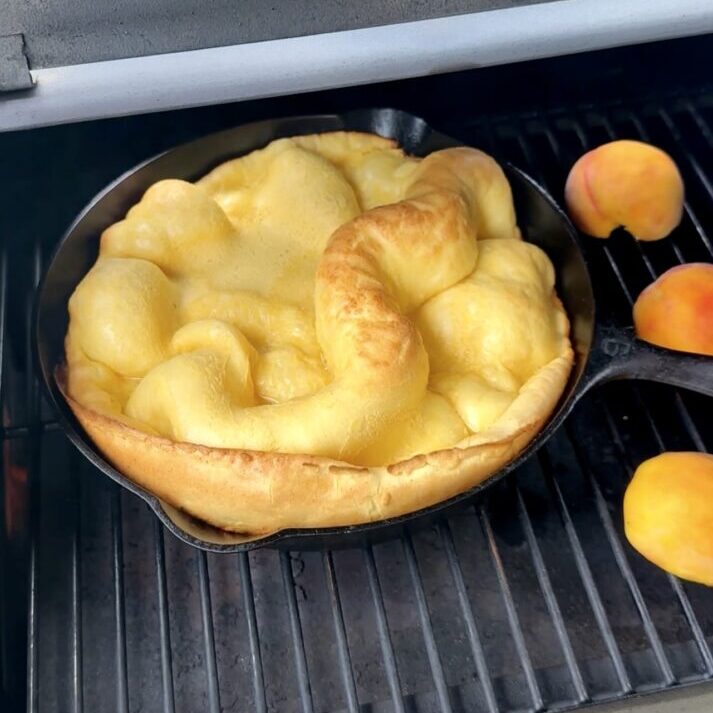 grilled dutch baby aside halved peaches