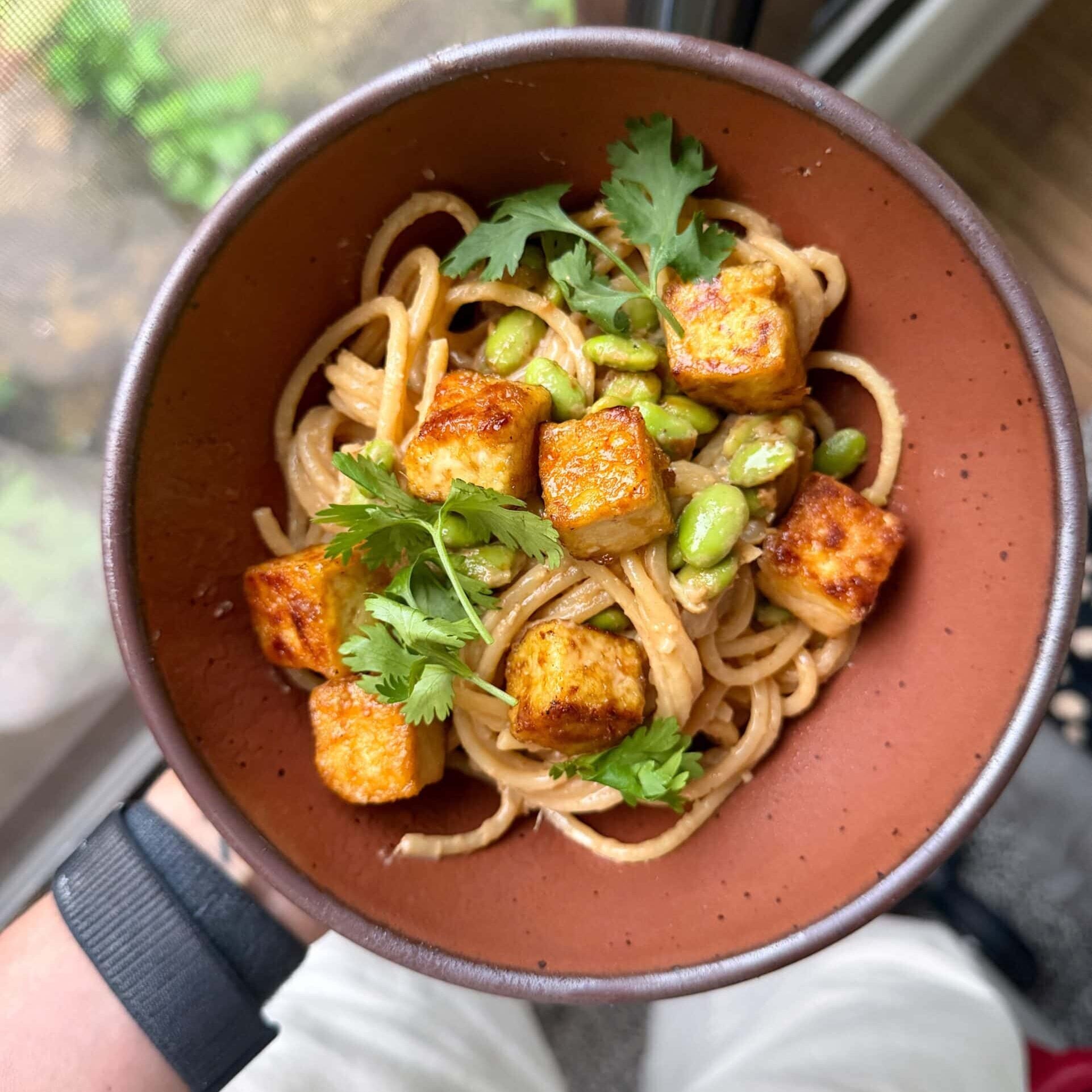 peanut noodle bowl with tofu and edamame
