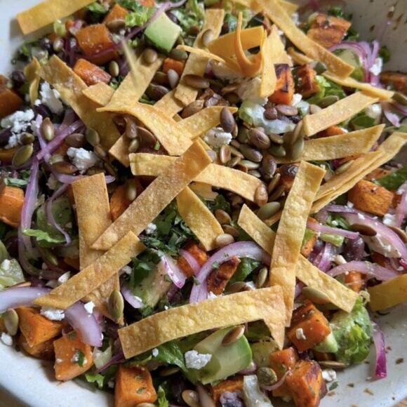 winter taco salad in bowl on cutting board